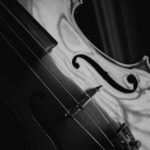 grayscale photo of a violin